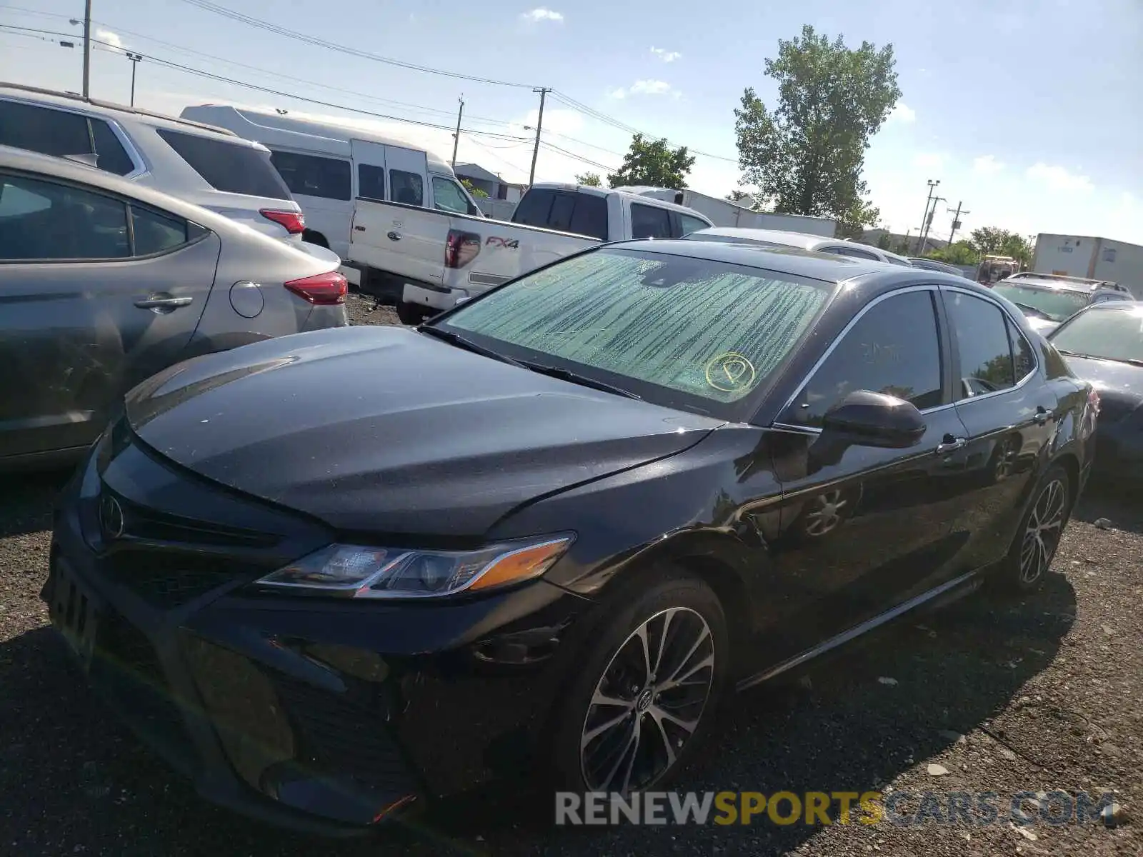 2 Photograph of a damaged car 4T1B11HK4KU734679 TOYOTA CAMRY 2019