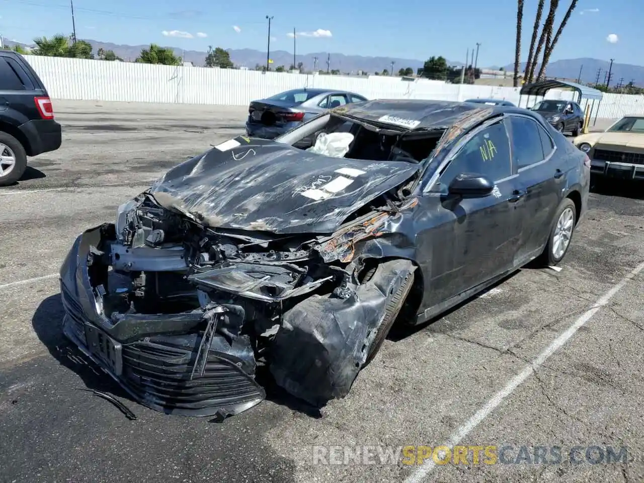 2 Photograph of a damaged car 4T1B11HK5KU754374 TOYOTA CAMRY 2019