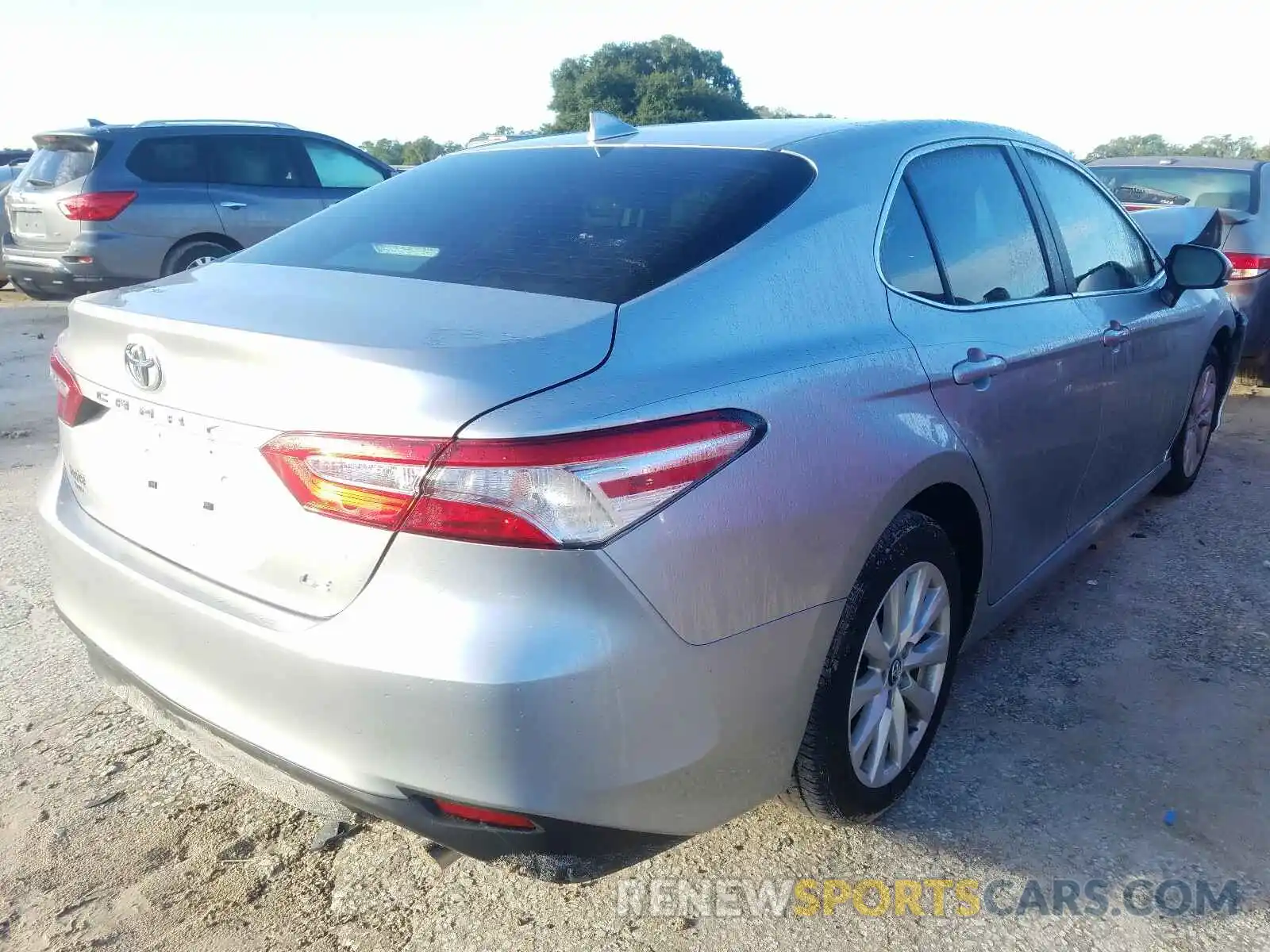 4 Photograph of a damaged car 4T1B11HK7KU729752 TOYOTA CAMRY 2019