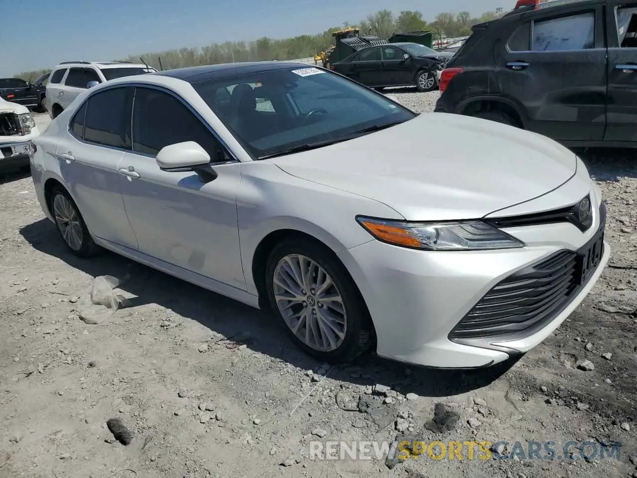4 Photograph of a damaged car 4T1B11HK7KU734384 TOYOTA CAMRY 2019
