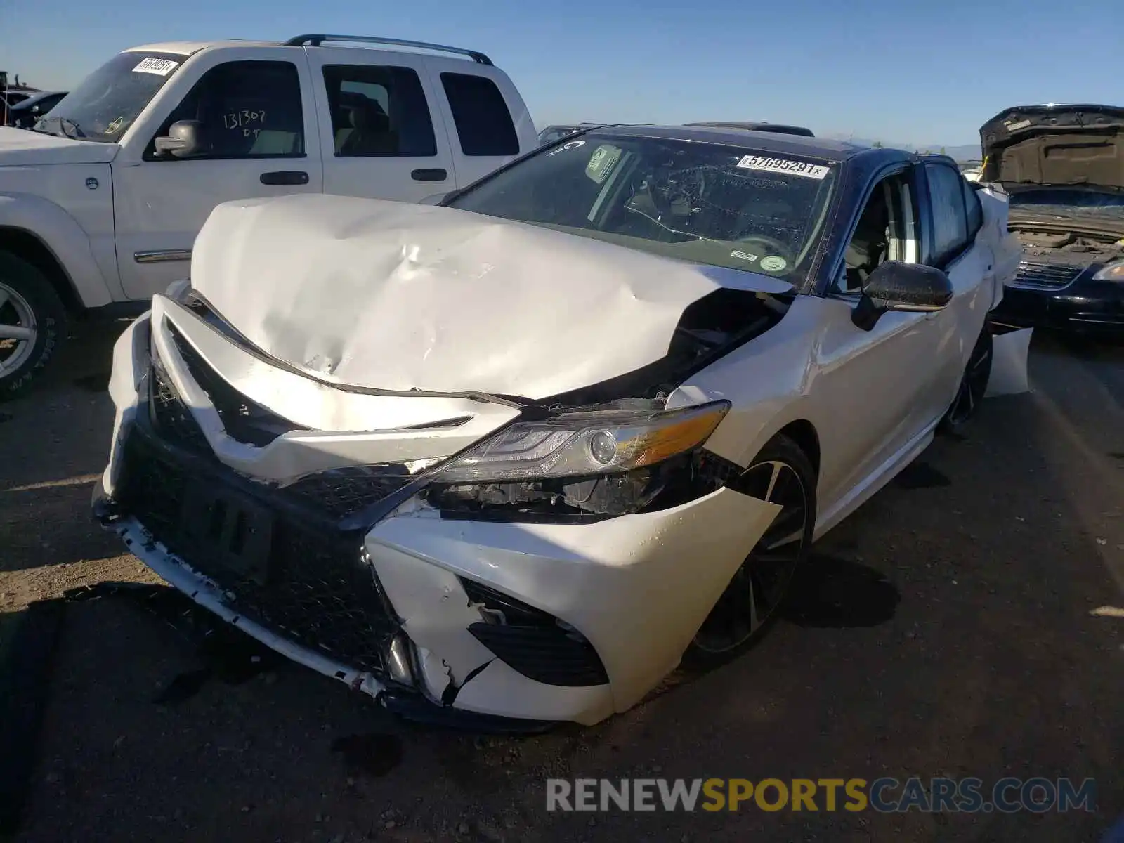 2 Photograph of a damaged car 4T1B61HK1KU219124 TOYOTA CAMRY 2019