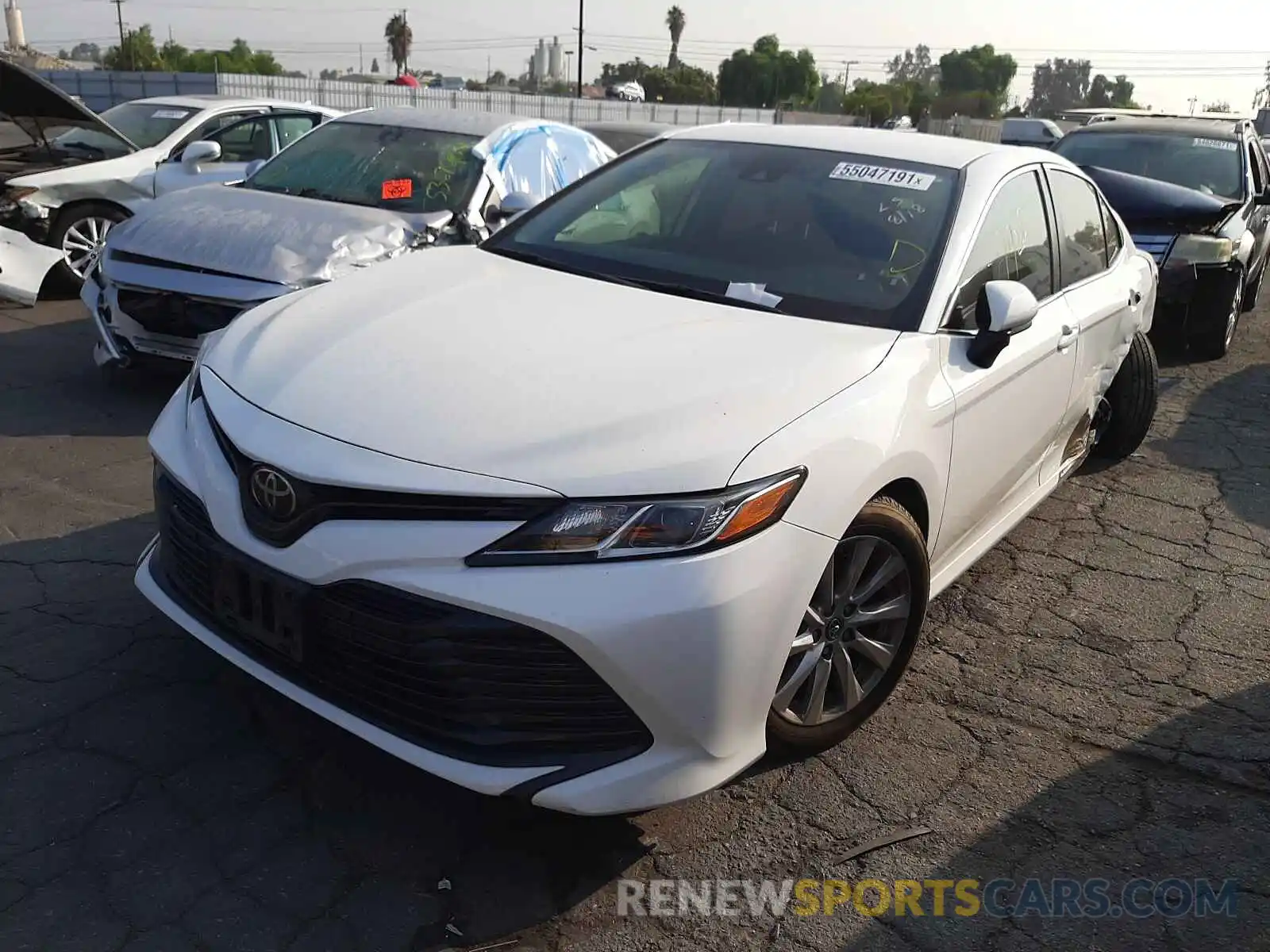 2 Photograph of a damaged car JTNB11HK0K3086649 TOYOTA CAMRY 2019