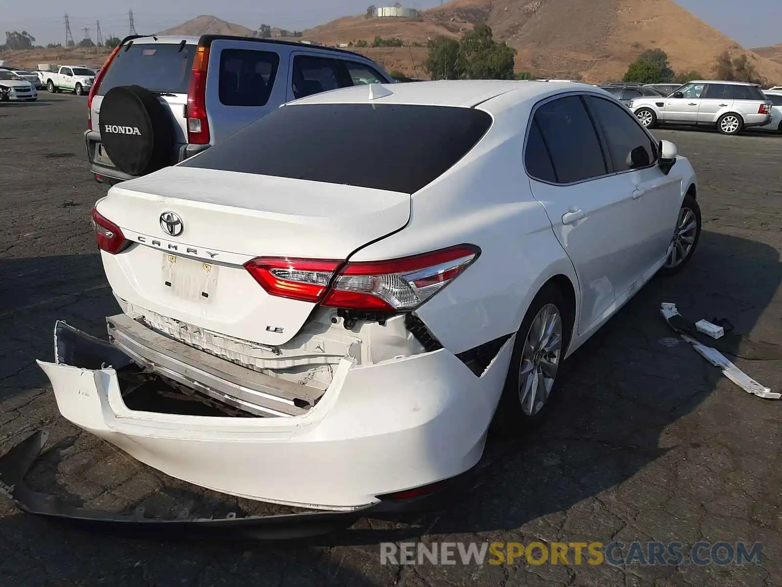 4 Photograph of a damaged car JTNB11HK0K3086649 TOYOTA CAMRY 2019