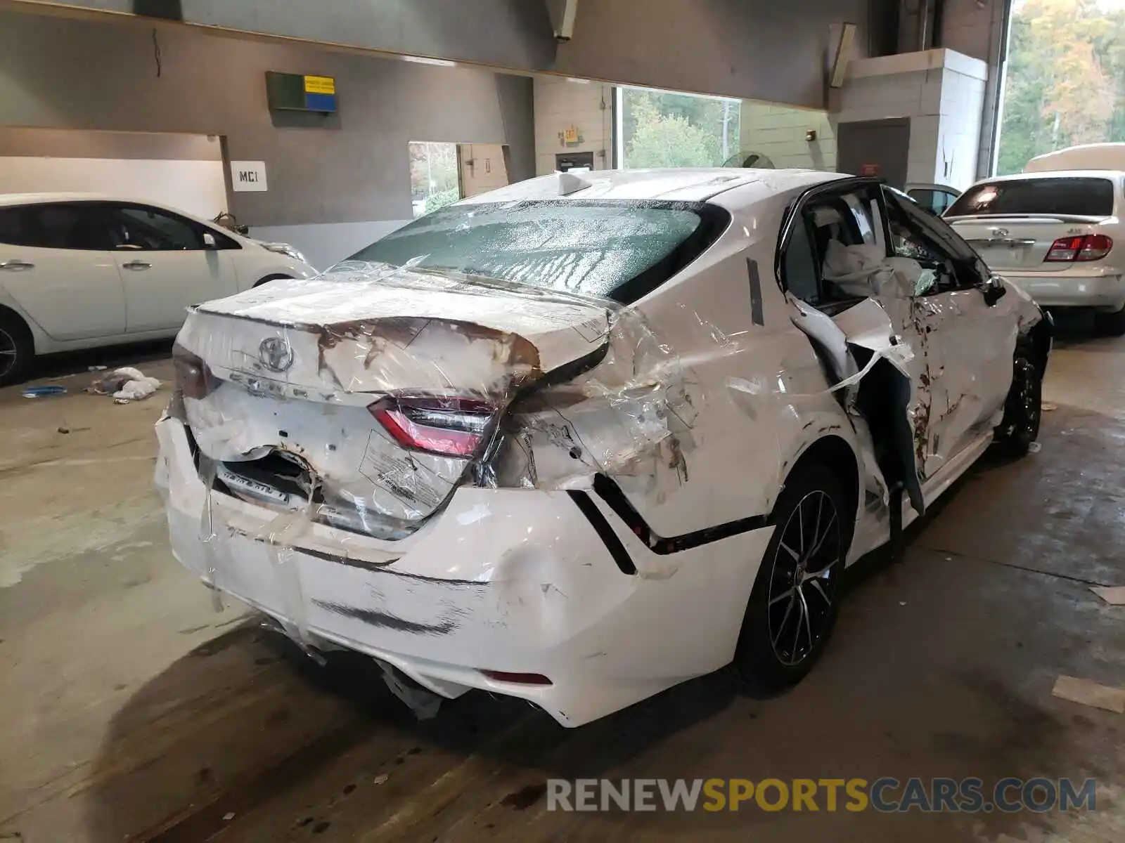 4 Photograph of a damaged car 4T1G11AK1MU523359 TOYOTA CAMRY 2021