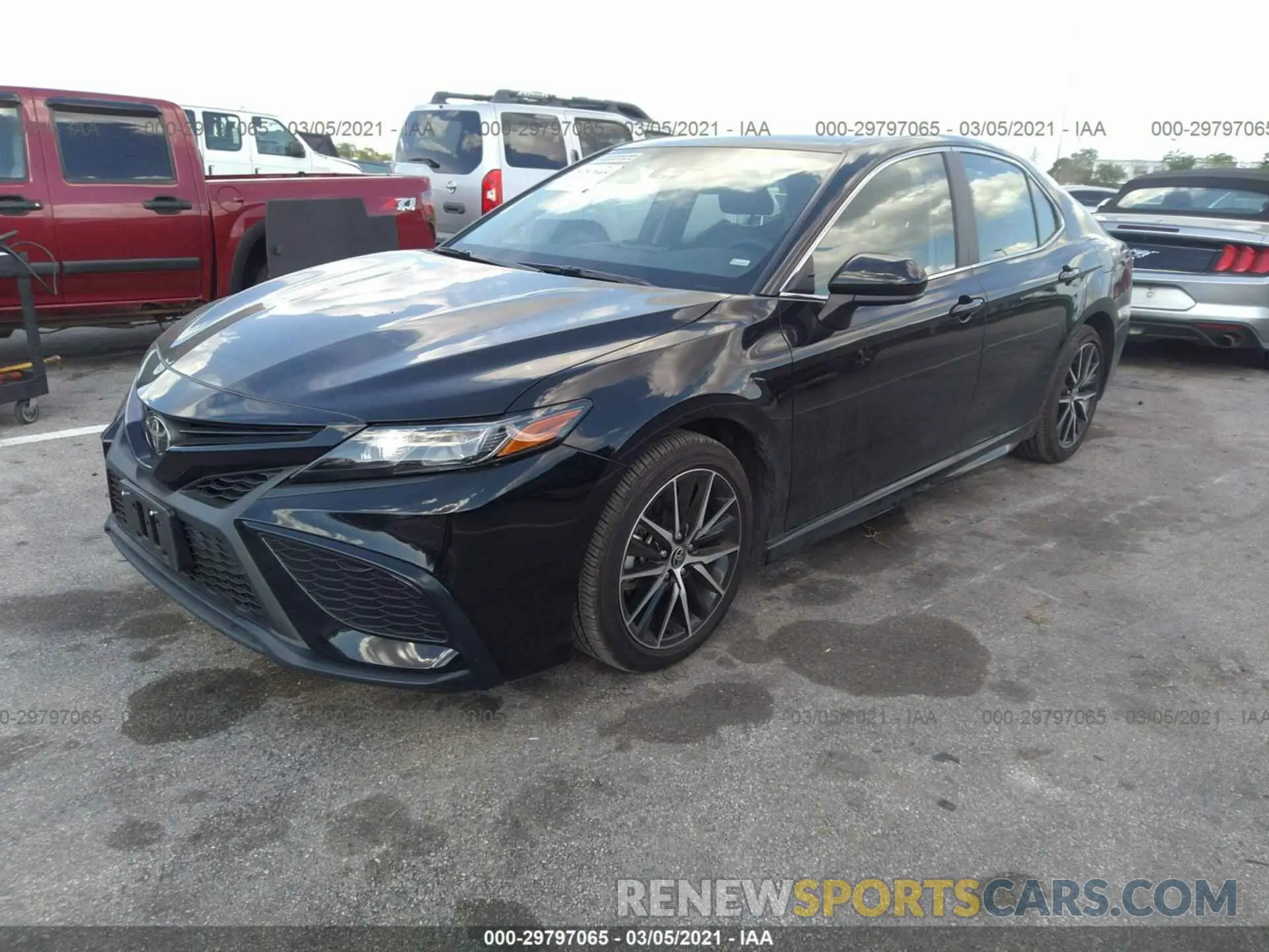 2 Photograph of a damaged car 4T1G11AKXMU413040 TOYOTA CAMRY 2021