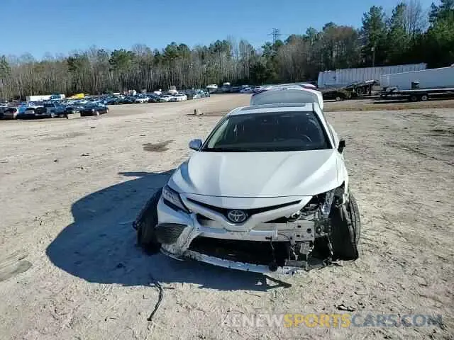 11 Photograph of a damaged car 4T1K31AK6MU029597 TOYOTA CAMRY 2021