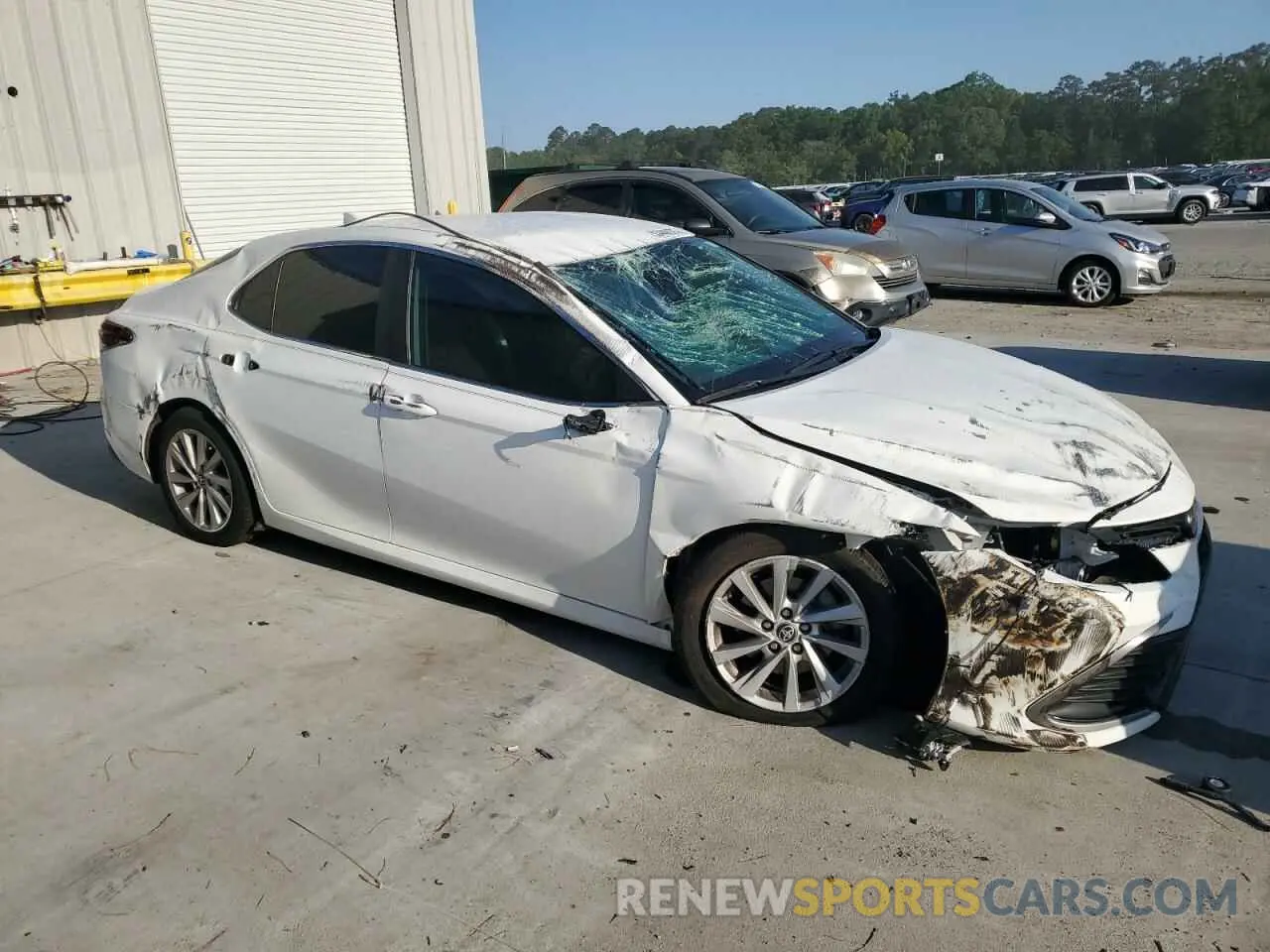 4 Photograph of a damaged car 4T1C11AK8PU077035 TOYOTA CAMRY 2023