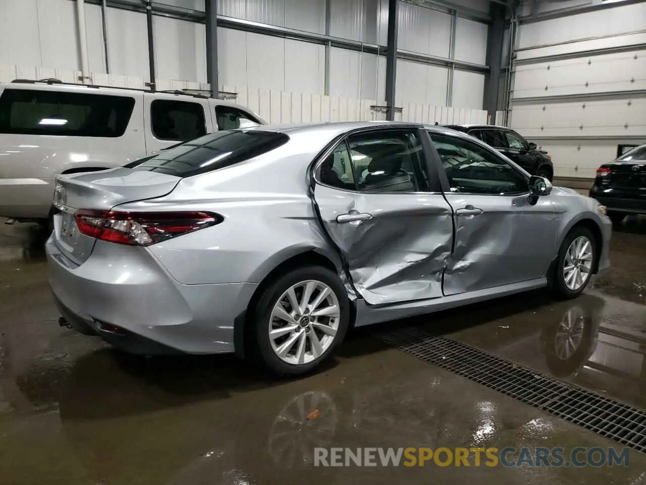 3 Photograph of a damaged car 4T1R11AK8PU834932 TOYOTA CAMRY 2023