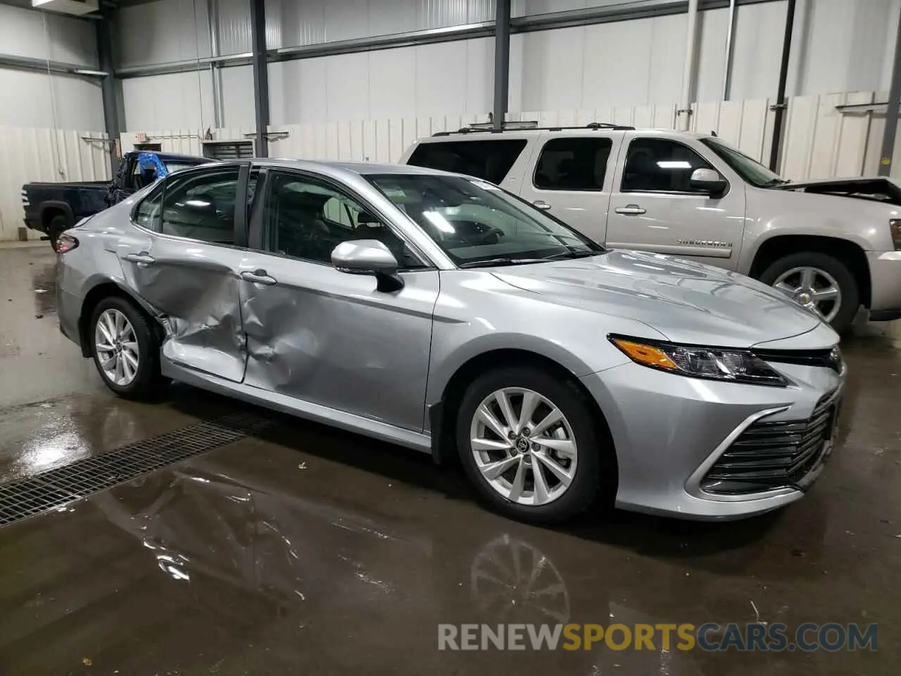 4 Photograph of a damaged car 4T1R11AK8PU834932 TOYOTA CAMRY 2023
