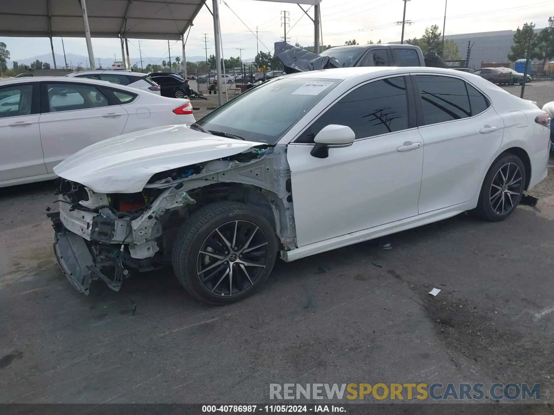 2 Photograph of a damaged car 4T1T11AK6PU809971 TOYOTA CAMRY 2023