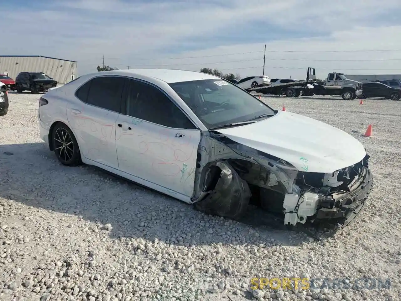 4 Photograph of a damaged car 4T1T11AK6PU830383 TOYOTA CAMRY 2023