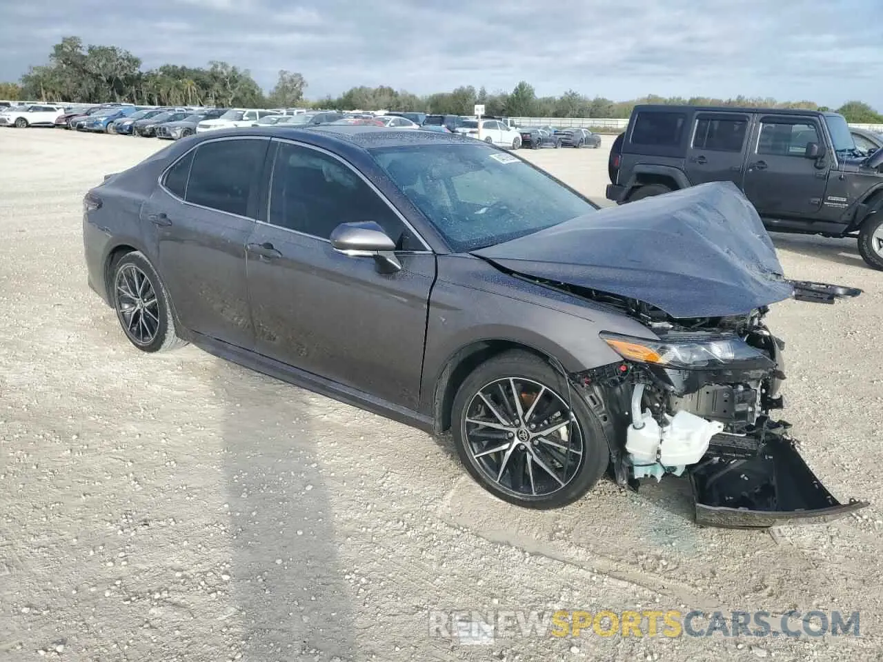 4 Photograph of a damaged car 4T1T11AK8PU153871 TOYOTA CAMRY 2023