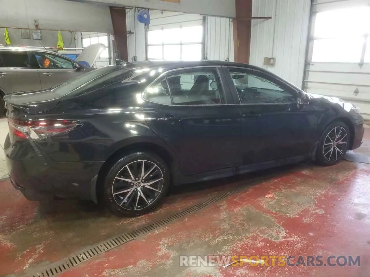 3 Photograph of a damaged car 4T1T11AKXPU747670 TOYOTA CAMRY 2023