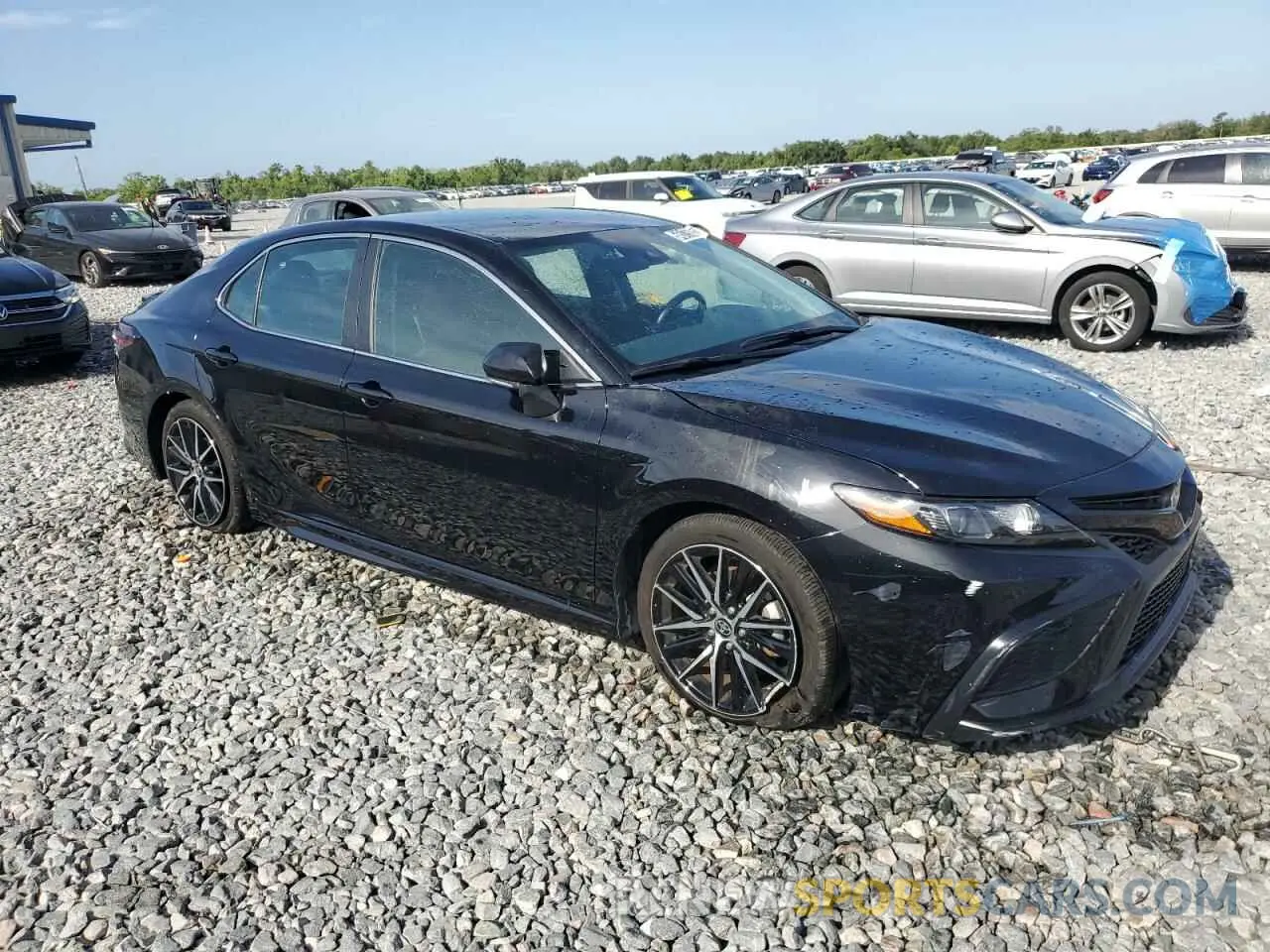 4 Photograph of a damaged car 4T1G11AKXRU885603 TOYOTA CAMRY 2024