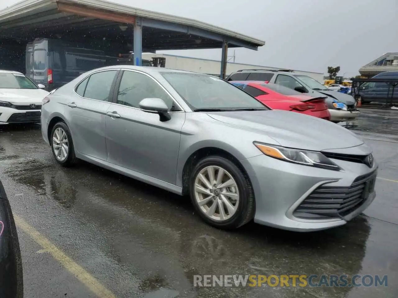4 Photograph of a damaged car 4T1R11AK2RU873387 TOYOTA CAMRY 2024