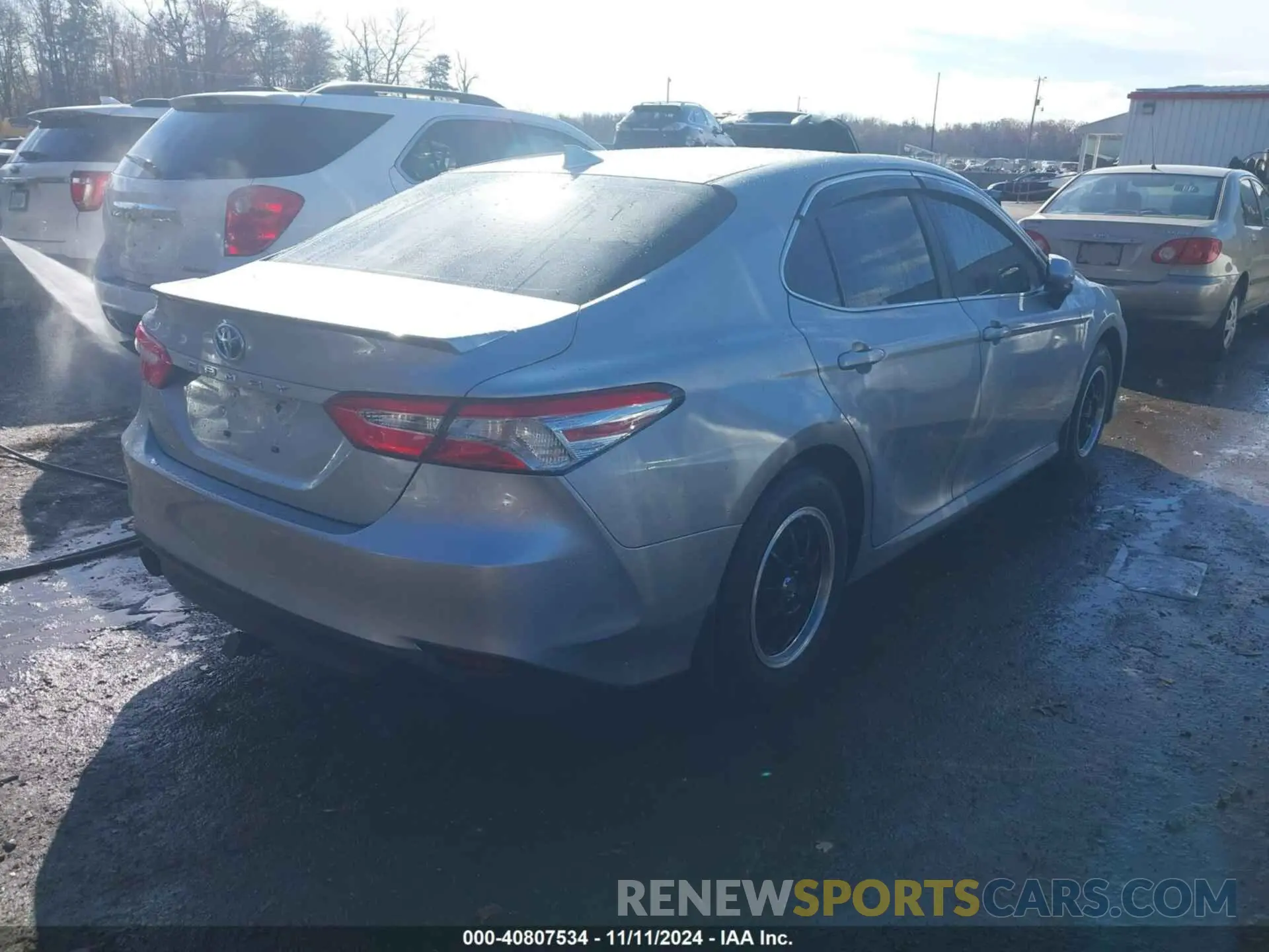 4 Photograph of a damaged car 4T1B31HK6KU516916 TOYOTA CAMRY HYBRID 2019