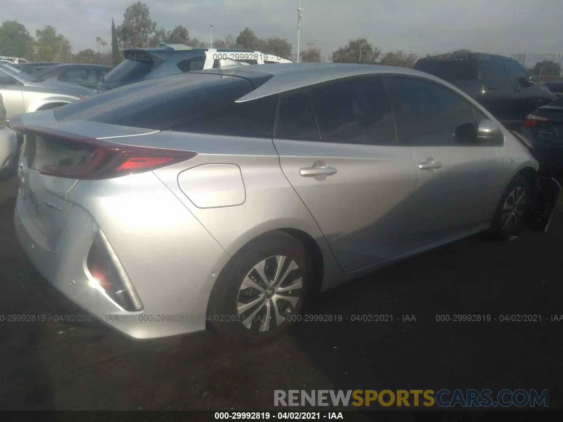 4 Photograph of a damaged car JTDKAMFP3M3165028 TOYOTA PRIUS PRIME 2021