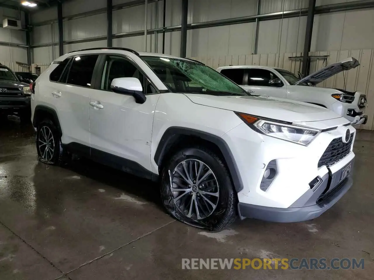 4 Photograph of a damaged car JTMP1RFV6KD518659 TOYOTA RAV4 2019
