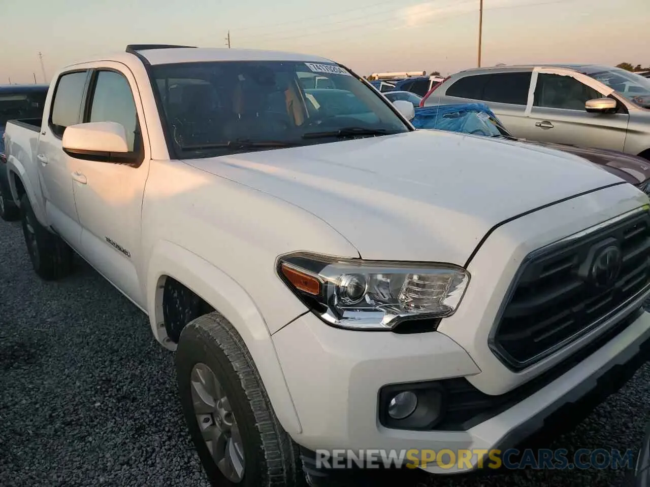 4 Photograph of a damaged car 3TMAZ5CN0KM098669 TOYOTA TACOMA 2019