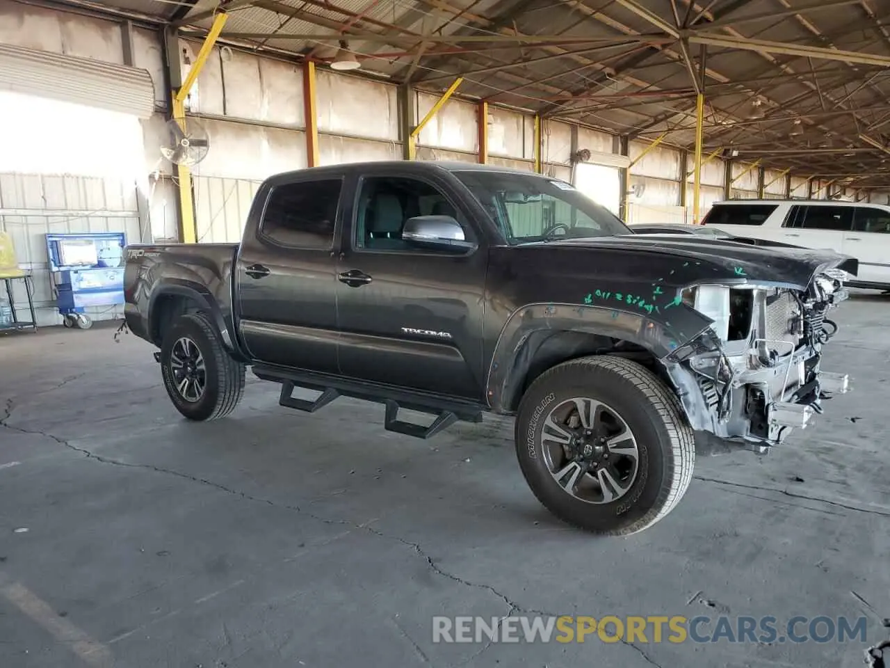 4 Photograph of a damaged car 3TMAZ5CN8KM100992 TOYOTA TACOMA 2019