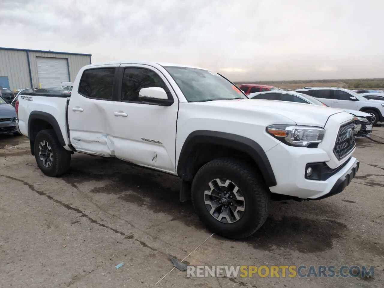 4 Photograph of a damaged car 3TMAZ5CN9KM103142 TOYOTA TACOMA 2019