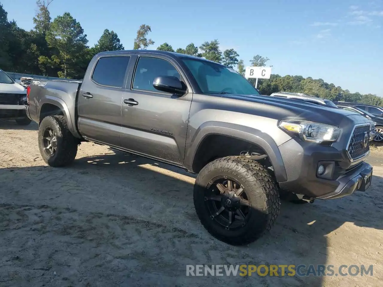 4 Photograph of a damaged car 3TMCZ5AN0KM246038 TOYOTA TACOMA 2019