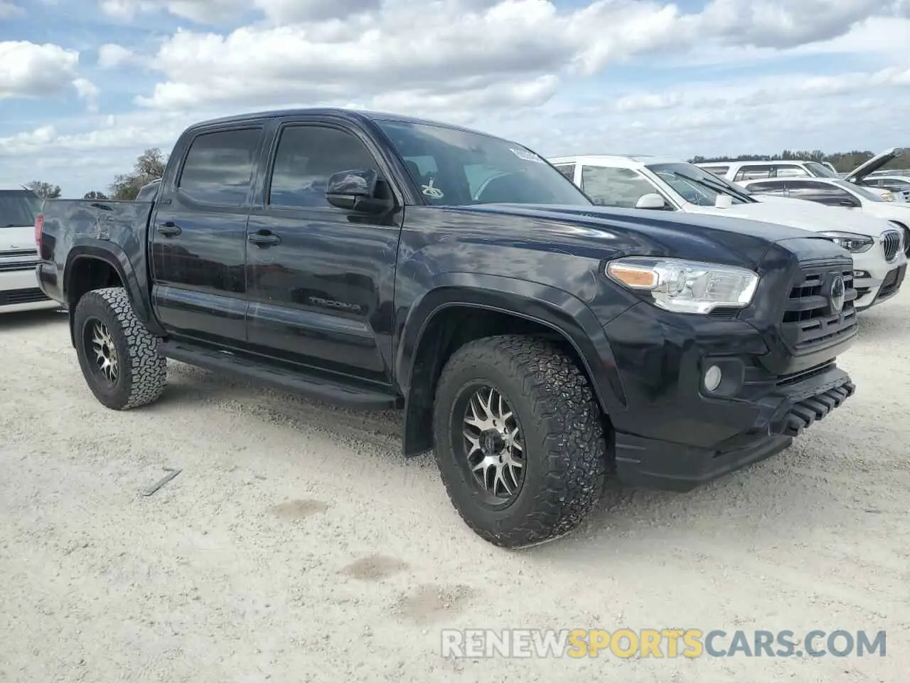 4 Photograph of a damaged car 3TMCZ5AN1KM208785 TOYOTA TACOMA 2019