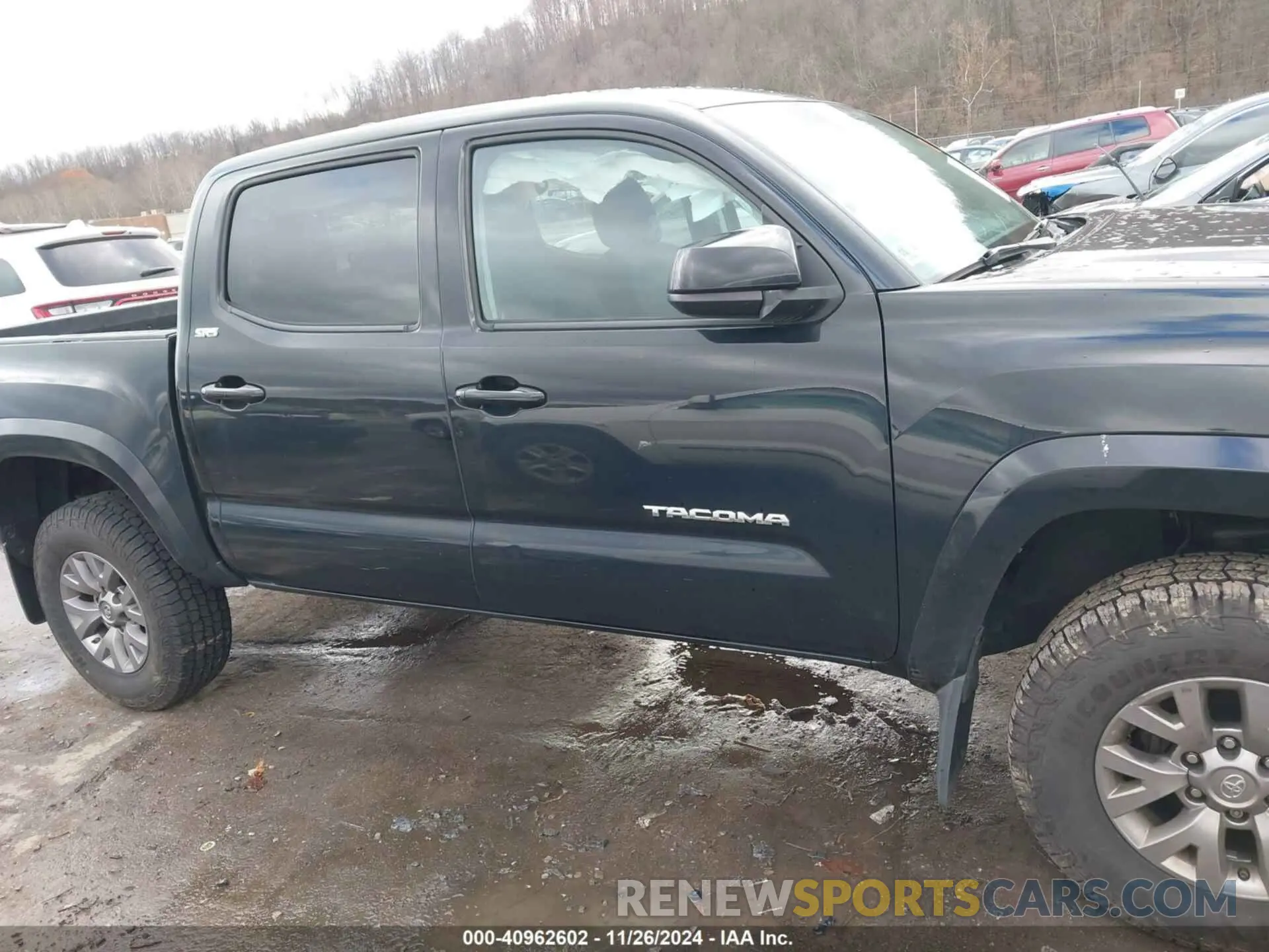 13 Photograph of a damaged car 3TMCZ5AN6KM203517 TOYOTA TACOMA 2019