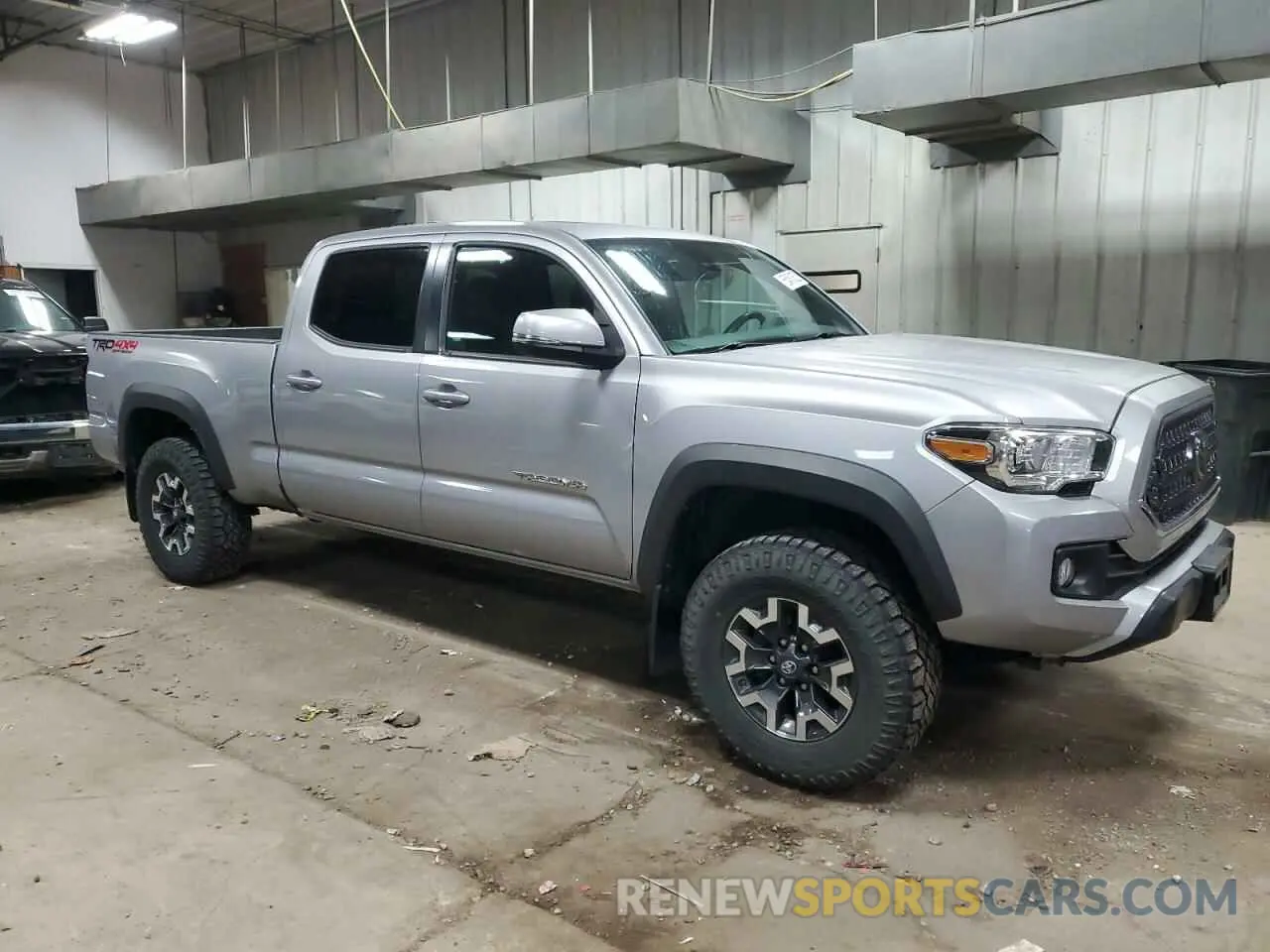 4 Photograph of a damaged car 3TMDZ5BN2KM059614 TOYOTA TACOMA 2019