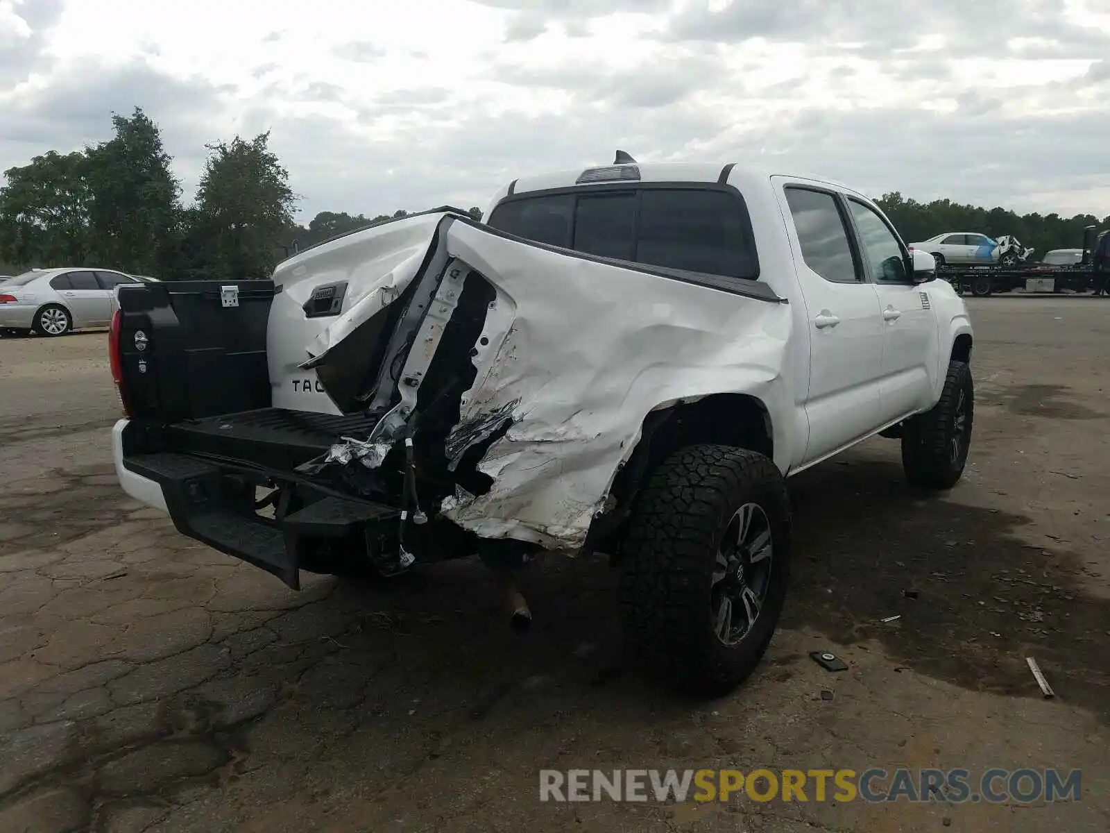 4 Photograph of a damaged car 5TFAX5GN8KX141410 TOYOTA TACOMA 2019