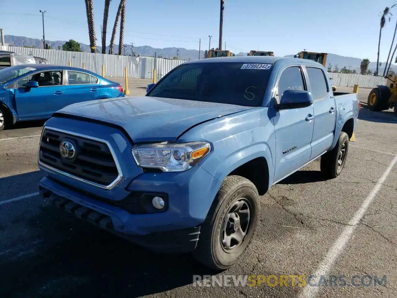 2 Photograph of a damaged car 5TFAX5GN9KX136894 TOYOTA TACOMA 2019