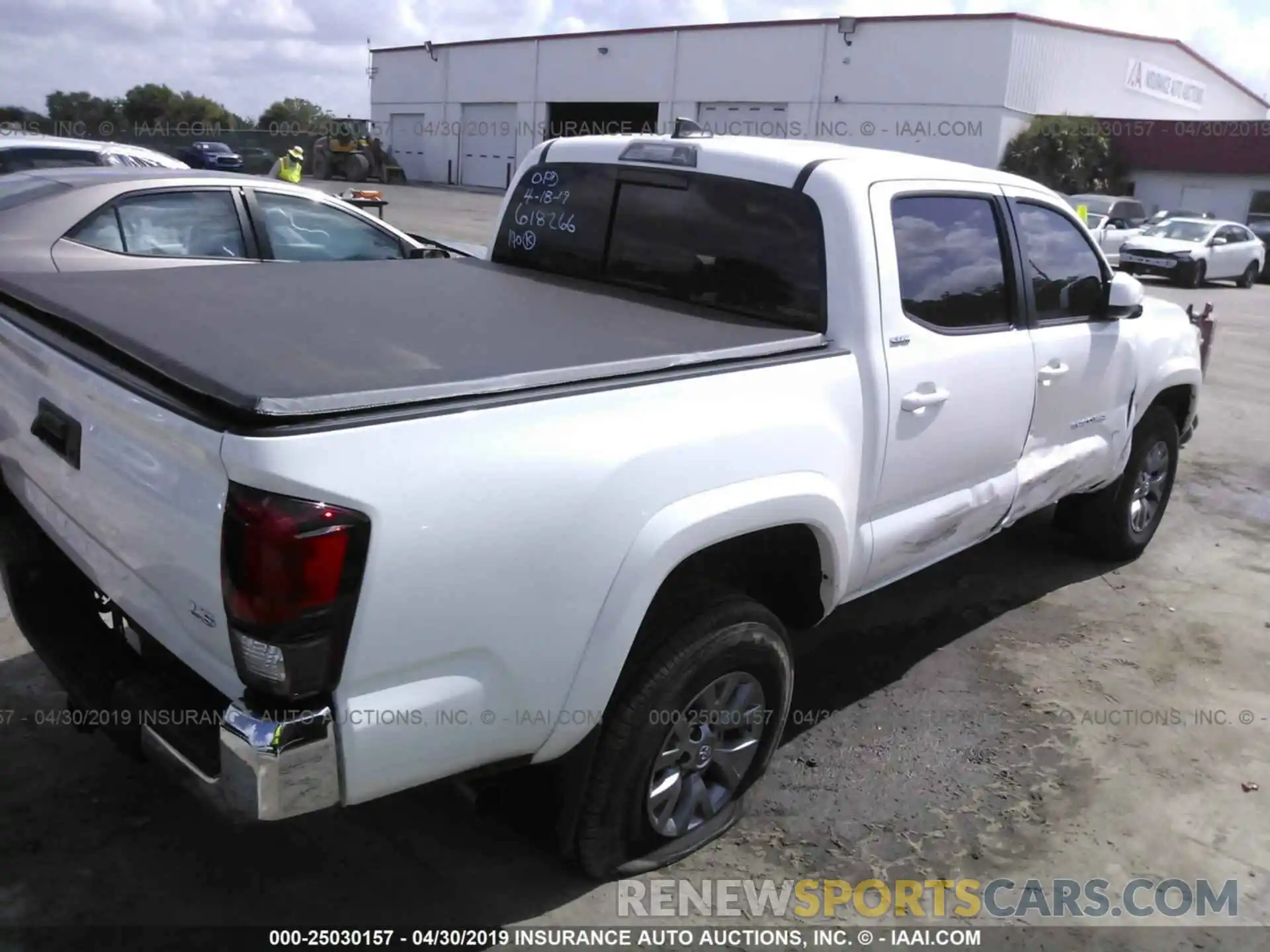 4 Photograph of a damaged car 5TFAZ5CN6KX078601 TOYOTA TACOMA 2019