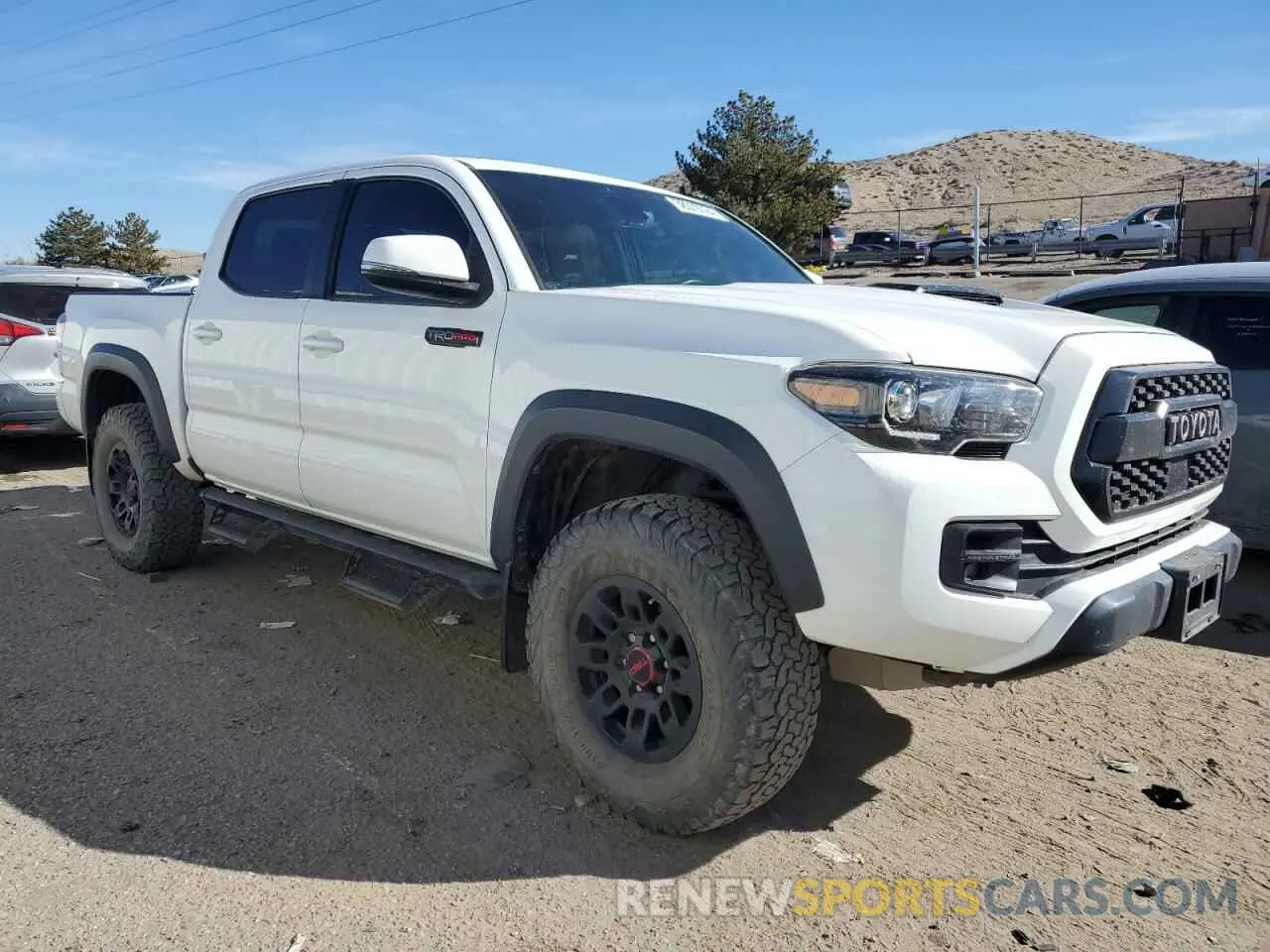 4 Photograph of a damaged car 5TFCZ5AN1KX205024 TOYOTA TACOMA 2019