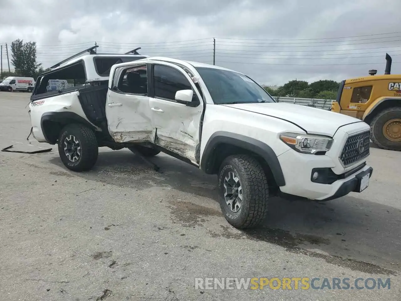 4 Photograph of a damaged car 5TFCZ5AN1KX209607 TOYOTA TACOMA 2019