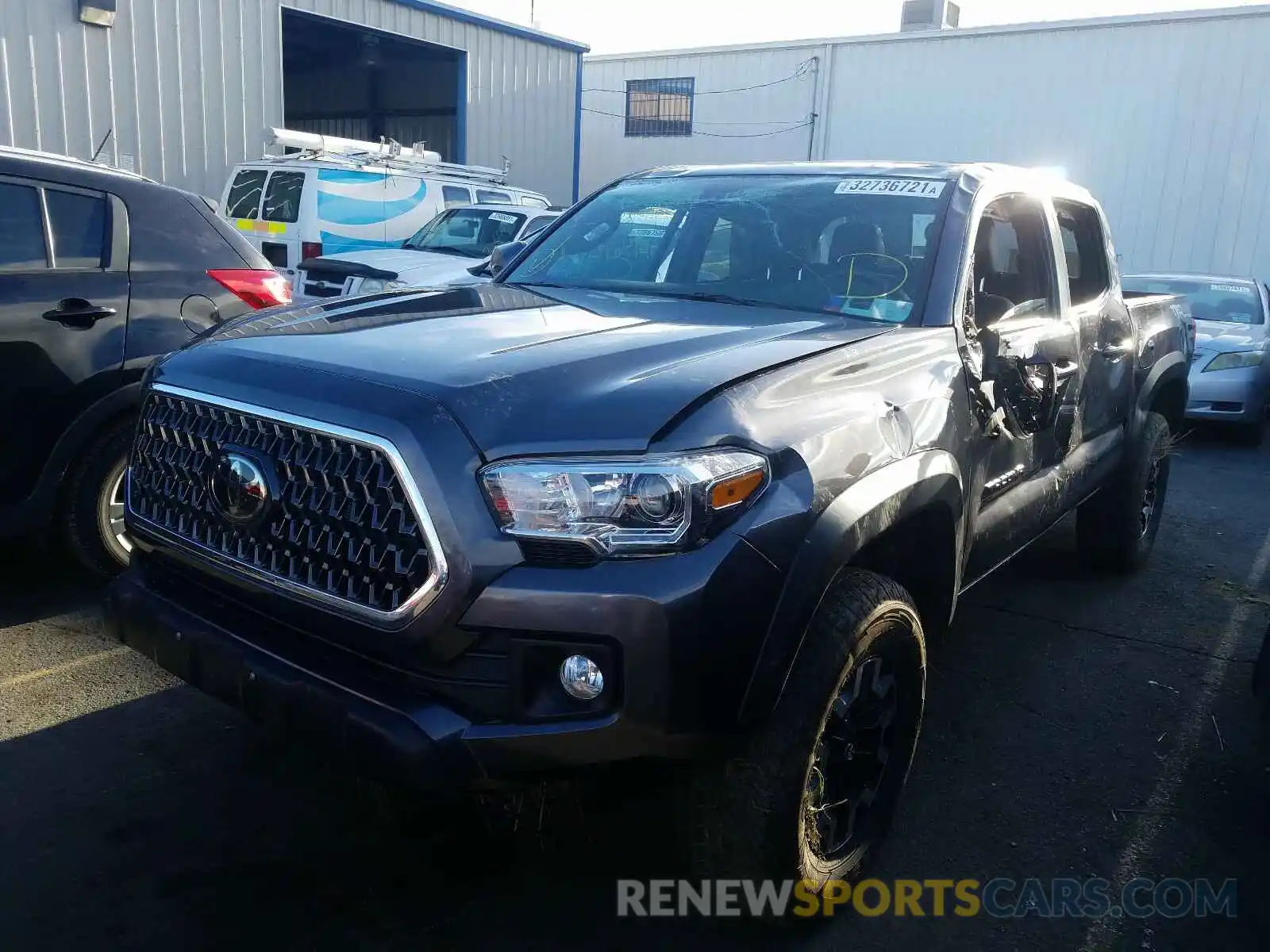 2 Photograph of a damaged car 5TFCZ5AN1KX210403 TOYOTA TACOMA 2019