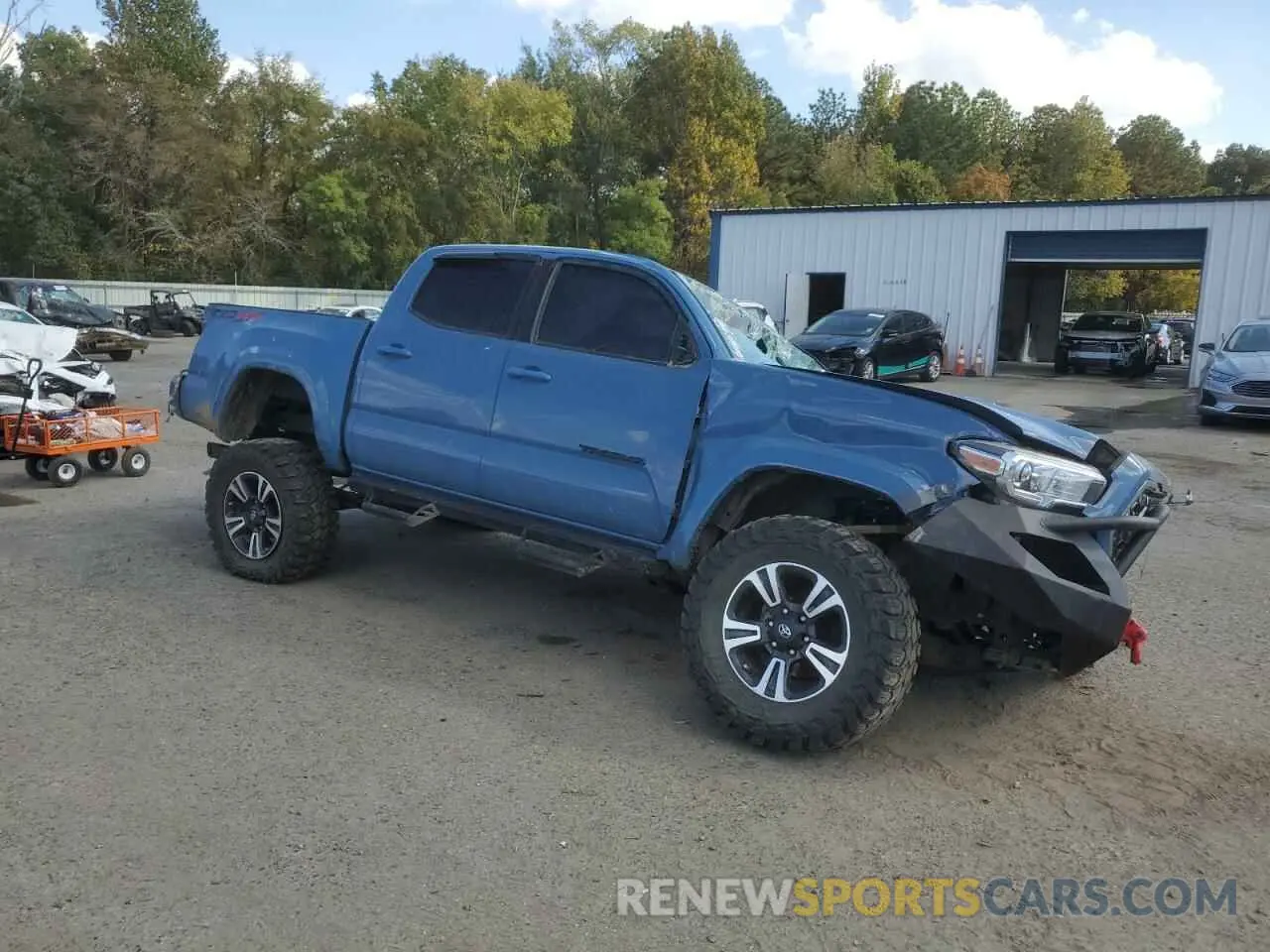4 Photograph of a damaged car 5TFCZ5AN1KX210451 TOYOTA TACOMA 2019