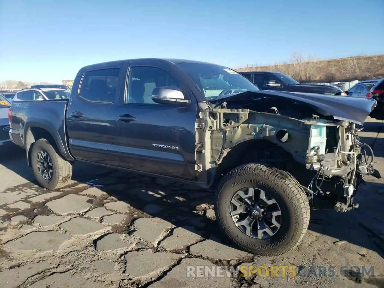 4 Photograph of a damaged car 5TFCZ5AN3KX171359 TOYOTA TACOMA 2019