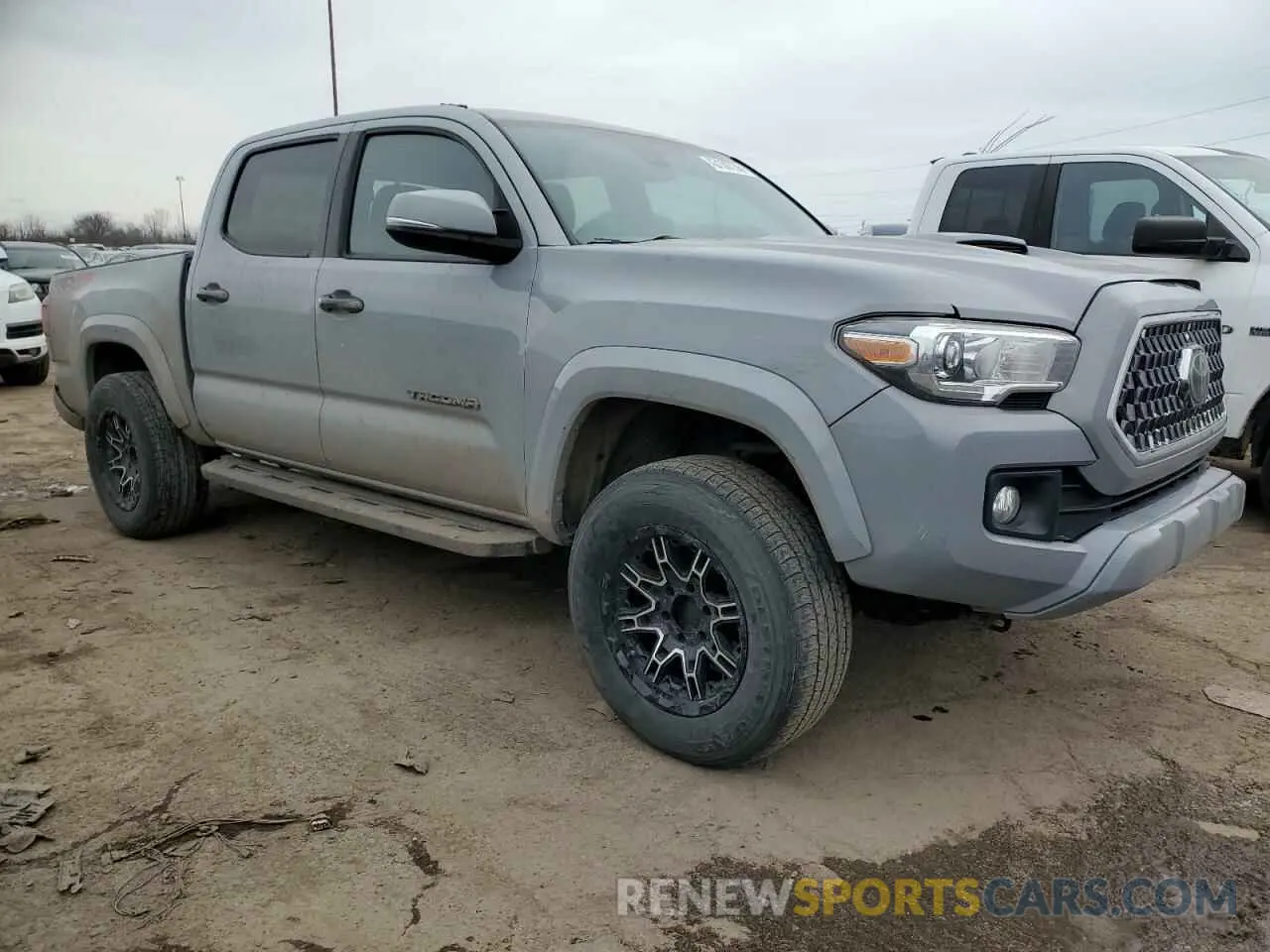 4 Photograph of a damaged car 5TFCZ5AN3KX174701 TOYOTA TACOMA 2019