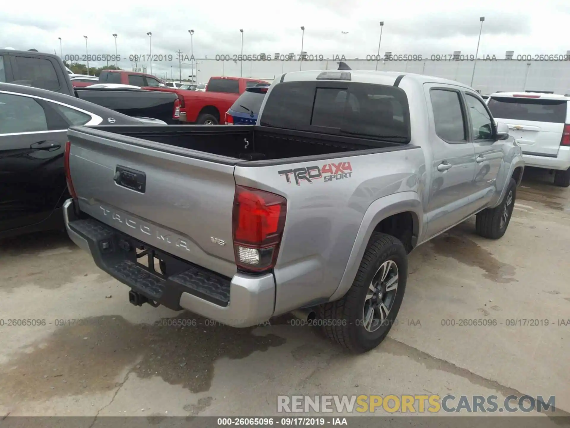 4 Photograph of a damaged car 5TFCZ5AN3KX203226 TOYOTA TACOMA 2019