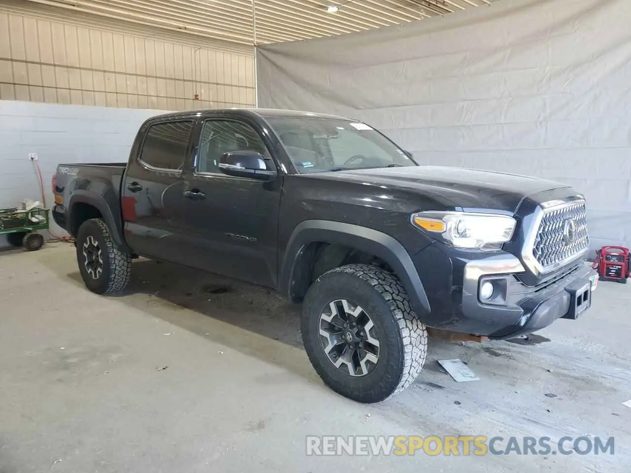 4 Photograph of a damaged car 5TFCZ5AN5KX185683 TOYOTA TACOMA 2019