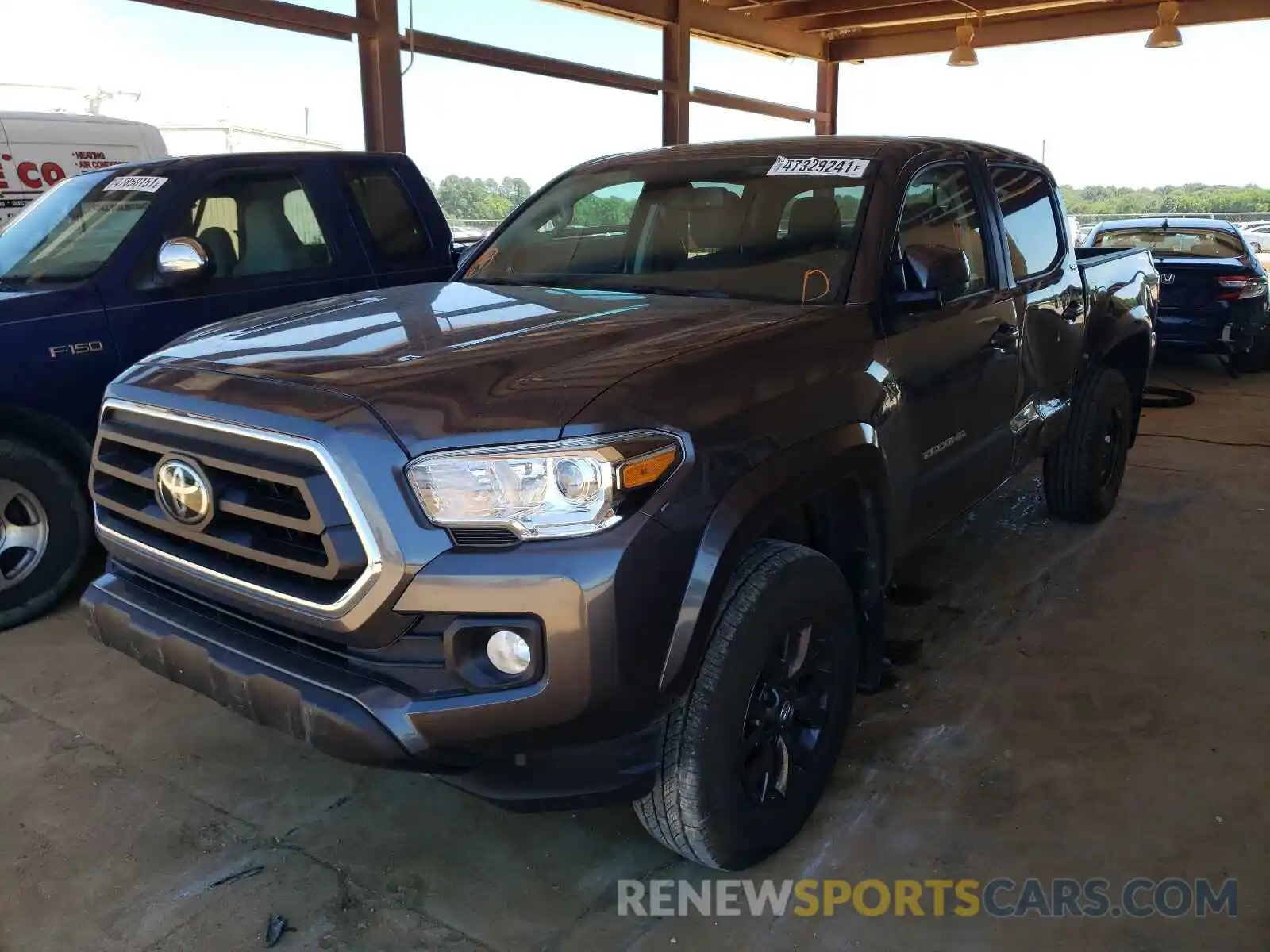 2 Photograph of a damaged car 5TFAZ5CN9LX094096 TOYOTA TACOMA 2020