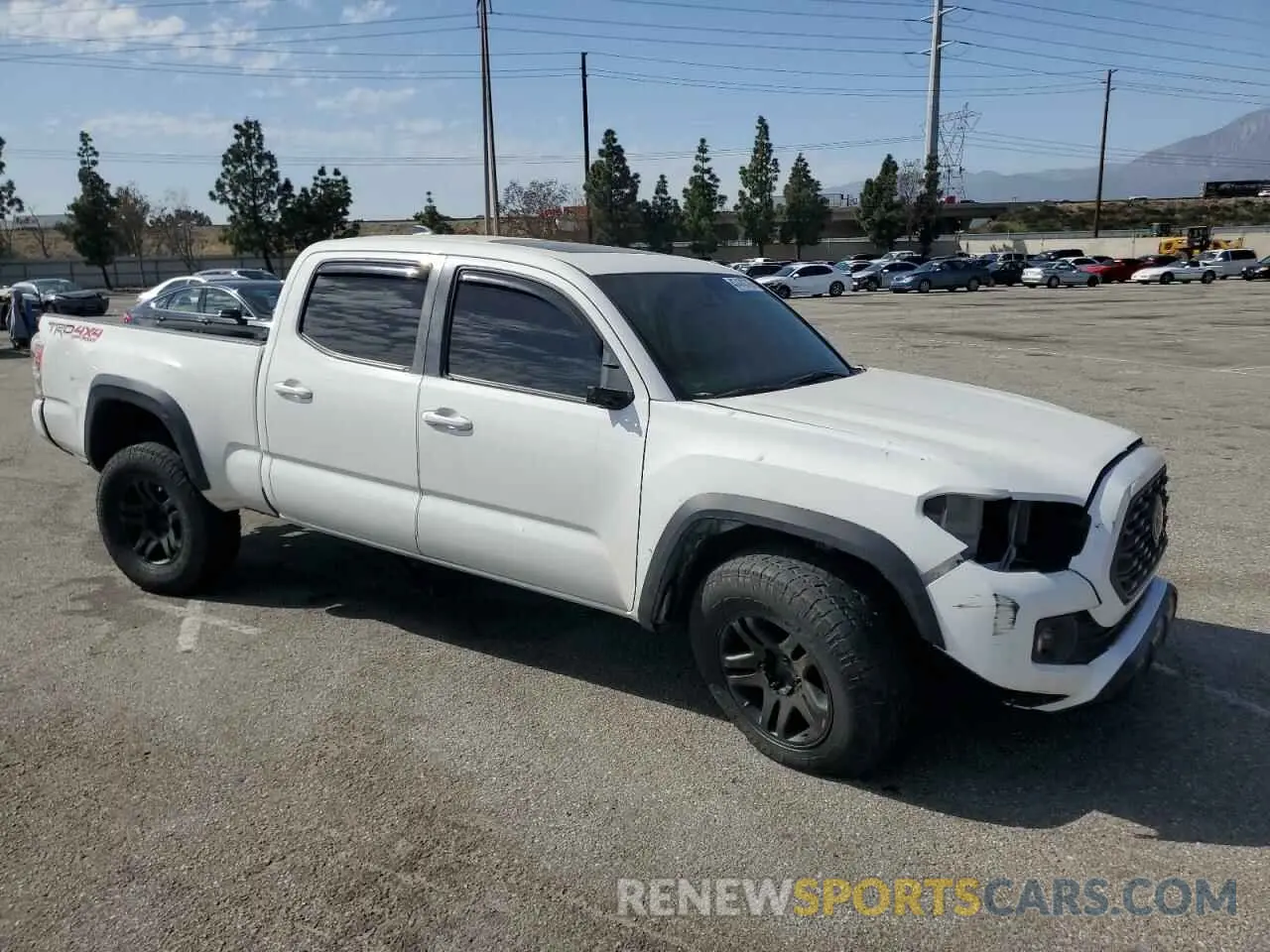 4 Photograph of a damaged car 3TMDZ5BN3NM124880 TOYOTA TACOMA 2022