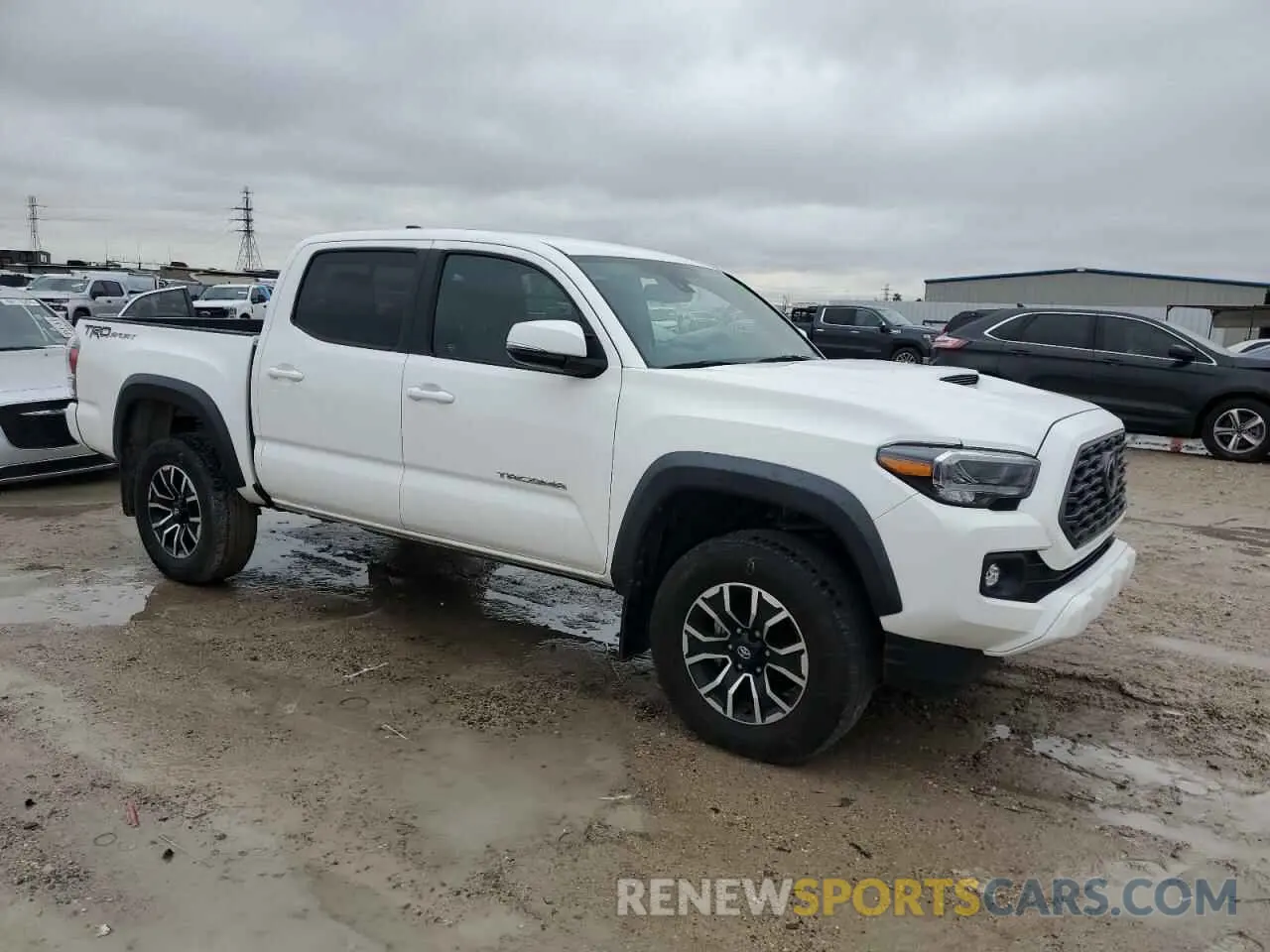4 Photograph of a damaged car 3TMAZ5CN3PM202949 TOYOTA TACOMA 2023