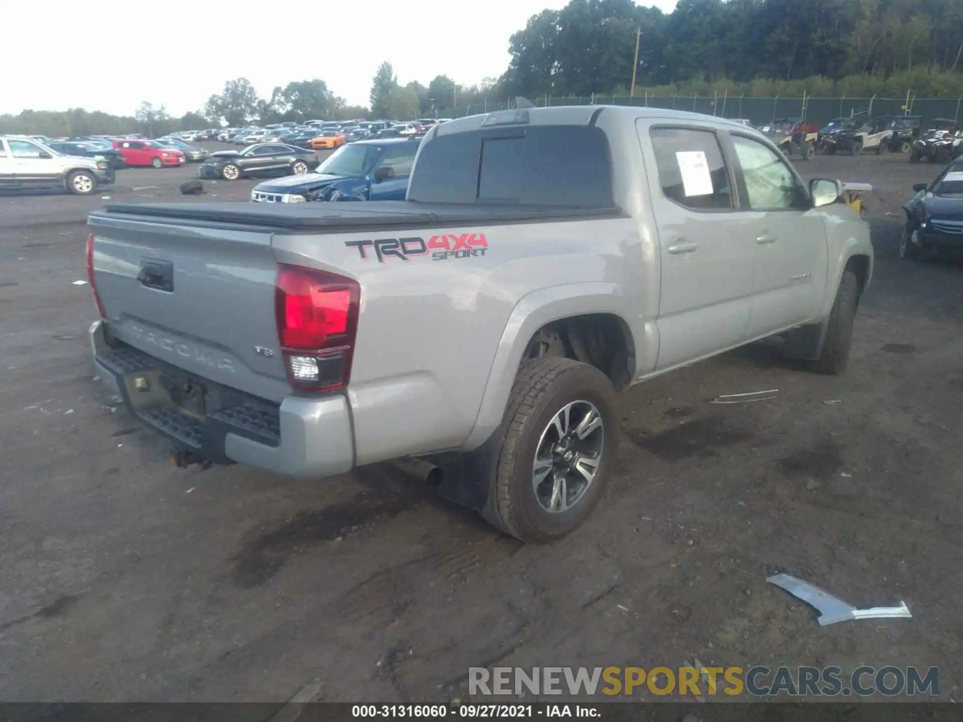 4 Photograph of a damaged car 3TMCZ5AN5KM268679 TOYOTA TACOMA 4WD 2019