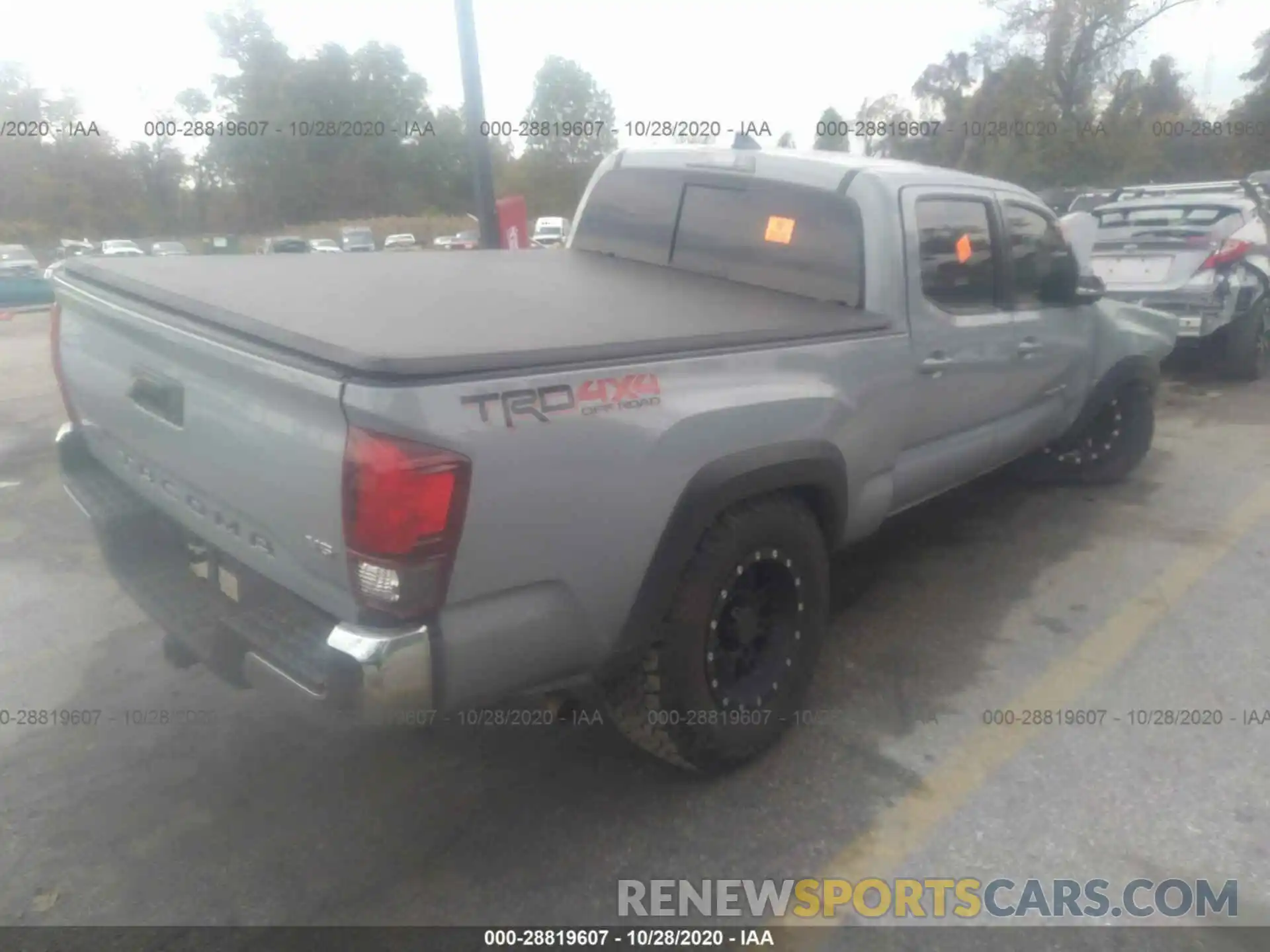 4 Photograph of a damaged car 3TMDZ5BN7KM060645 TOYOTA TACOMA 4WD 2019