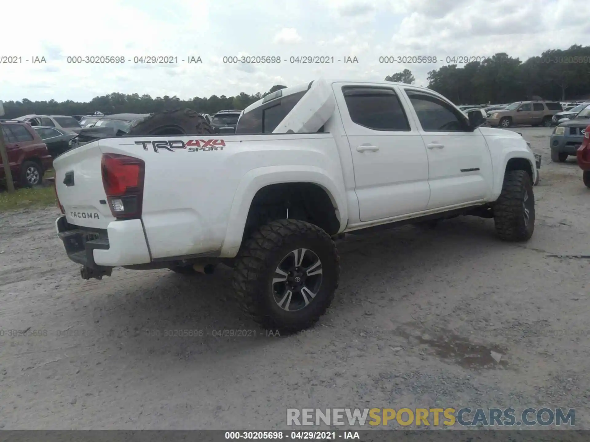 4 Photograph of a damaged car 5TFCZ5AN8KX188612 TOYOTA TACOMA 4WD 2019